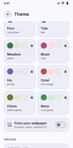 Themes screenshot: Theme screen scrolled to more families, the wallpaper option and a preview
